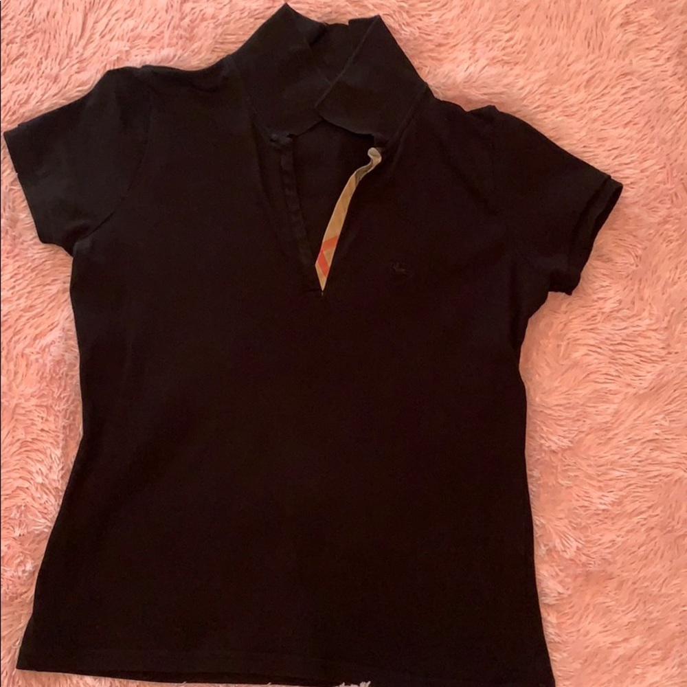 Black polo Burberry brand. No signs of wear.